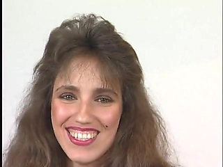 Beautiful brunette enjoys filling her pussy with a dildo