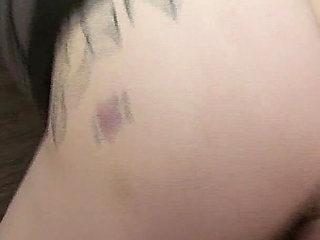 Tattooed Brunette Gets Fingered on the Couch and Cums Hard