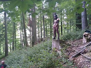 Standing Pissing in a Woods in a Bunny Mask and Fishnet