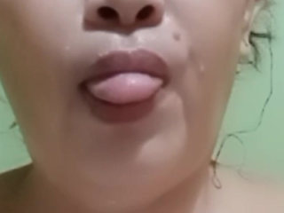 taking a bath and showing her beautiful face .