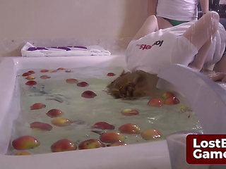 Four lesbians strip down while bobbing for apples