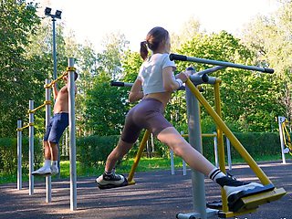 Outdoor sex with a hot milf and a young athlete in the woods.