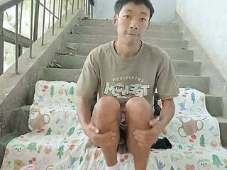 Cute Asian boy enjoys a wonderful time by ejaculating and consuming semen in the ruined stairwell on the eve of his birthday