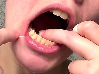 Flossing Teeth with Oral B Glide Dental Floss