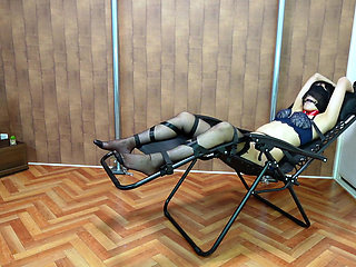 A Woman Is Restrained and Teased with Erotic Lotion