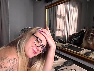 Sexy Tattooed Blonde Girl Doing Her Hair and Makeup Naked