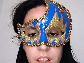 Girl in mask masturbating dances in front of camera