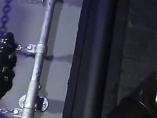 Lady Valeska and Miss Patricia have their sub over a bench.