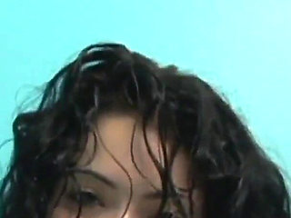 Tattooed brunette Andrea Kelly fucks her horny hairy pussy alone