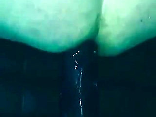 Riding a huge dildo.