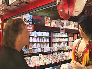 Amateur Brunette Gets a Blowjob to a Guy in the Sexy Shop