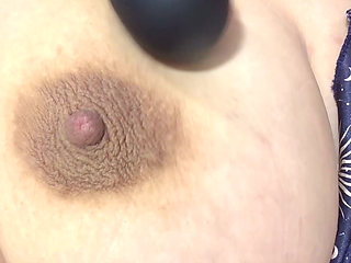 Mother masturbates with a vibrator her delicious tits