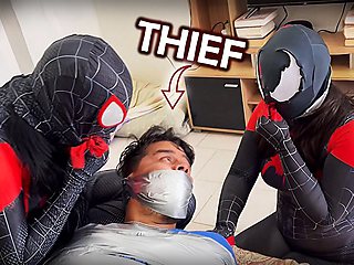 A man Mummified by Tape Gag Loving Spider-girls!