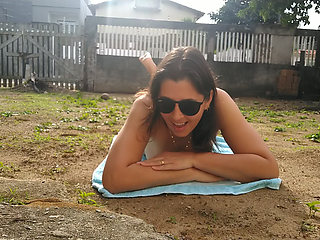 Wife sunbathing naked in front yard