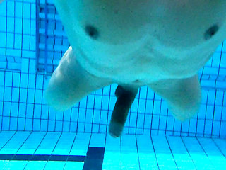 Indoor public pool solo uncut nude fit man swimming