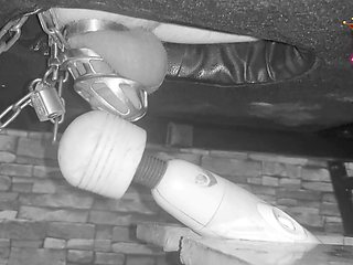 Female domination brings slave to climax in chastity cage on the stroking table