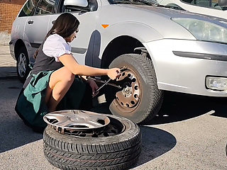 Dirndl Slut Gets Dirty and Oily Changing Tires