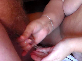 Closeup of John pissing on Jens hand