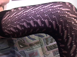 Brunette German slut in stockings fucks herself with orange dildo