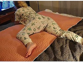 Cute Lazy Girl Wets Her Pyjamas Watching Tv Lying On Her Tummy!