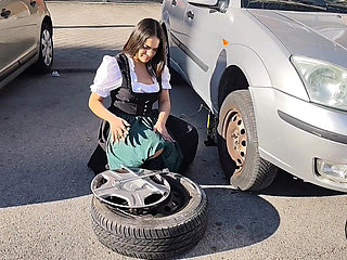 Dirndl Slut Gets Dirty and Oily Changing Tires