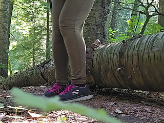Hiker Pees on a Log