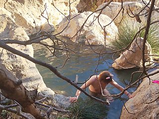 Cute sissy Wet Bibe enjoys a romantic bath in steaming springs with her girlfriend