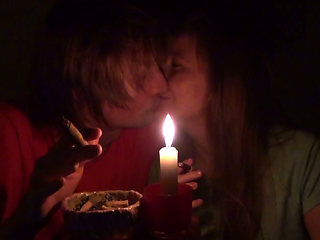 Couple Smoke Next to Candle