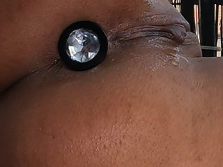 Tattooed MILF Stretches Both Holes with Plugs