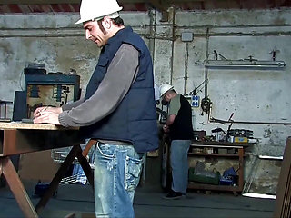 Two young sluts get fucked by workers in a garage