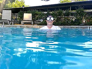 Couple Underwater Diving and Swimming