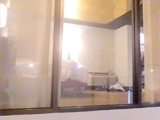 Caught Watching Her in Hotel Window and She Gives Him a Show