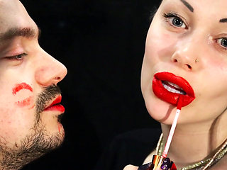 Covering Alex face with red lipsticks kisses