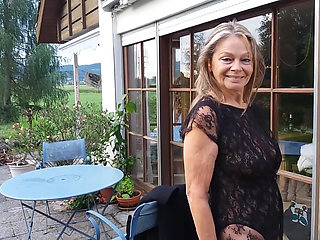 A Mature Woman Shows off Her Figure Outside in a Lace Bodysuit!