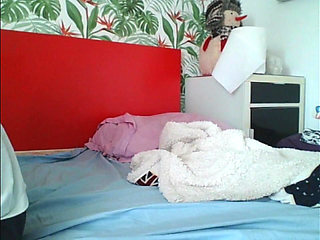 Alin play with his toy on the couch watching TV