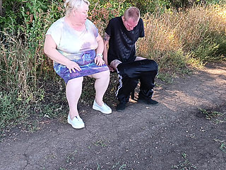 A neighbor sucks my dick in a public park on a bench until I cum