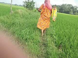 Village granny pee in the field