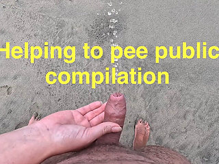 Girl helps to hold the dick while peeing public