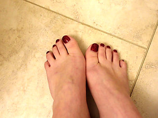 Quick New Pedicure Show off Glittery Red Toenails