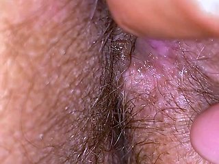 Playing with her hairy pussy and her anus