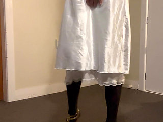 Sexy striptease down to a white bustier