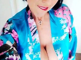 Busty curly brunette with big boobs fucks on couch