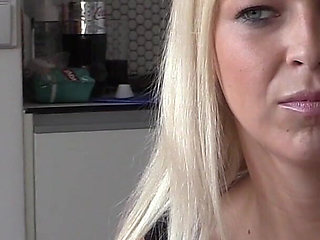 Seductive Blonde MILF Teases in Sheer Black Lace Lingerie