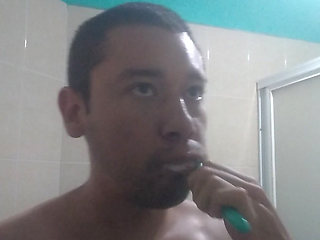 Man washes his face