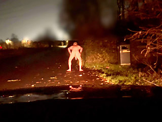 Strip naked and wank twerk at side of road , a car thought about driving up the lane
