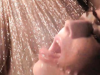 Huge-breasted brunette gets splashed with water under red lights in slow motion