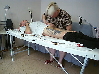 Mother-in-law sucks and jerks off my dick on the massage table and swallows cum