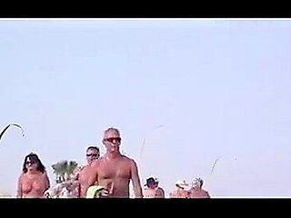 French nudist beach Cap d'Agde people walking in nature's garb 02