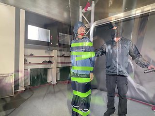 Marie M Tied, Gagged And Suspended In Shiny Nylon Rainwear