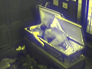 Couple Fucking in Coffin